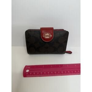Coach C0082 Small Trifold Wallet — Signature Brown Canvas with Red Leather Trim